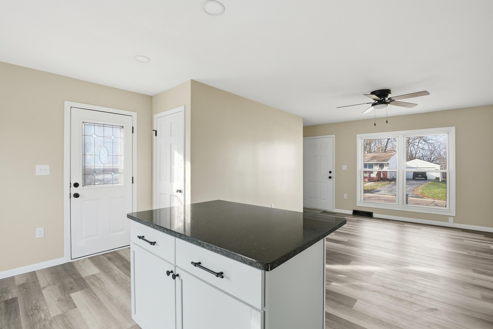1135 6th Street West Milan, IL 61264 - Photo 12 of 36 a view of kitchen with cabinets and wooden floor