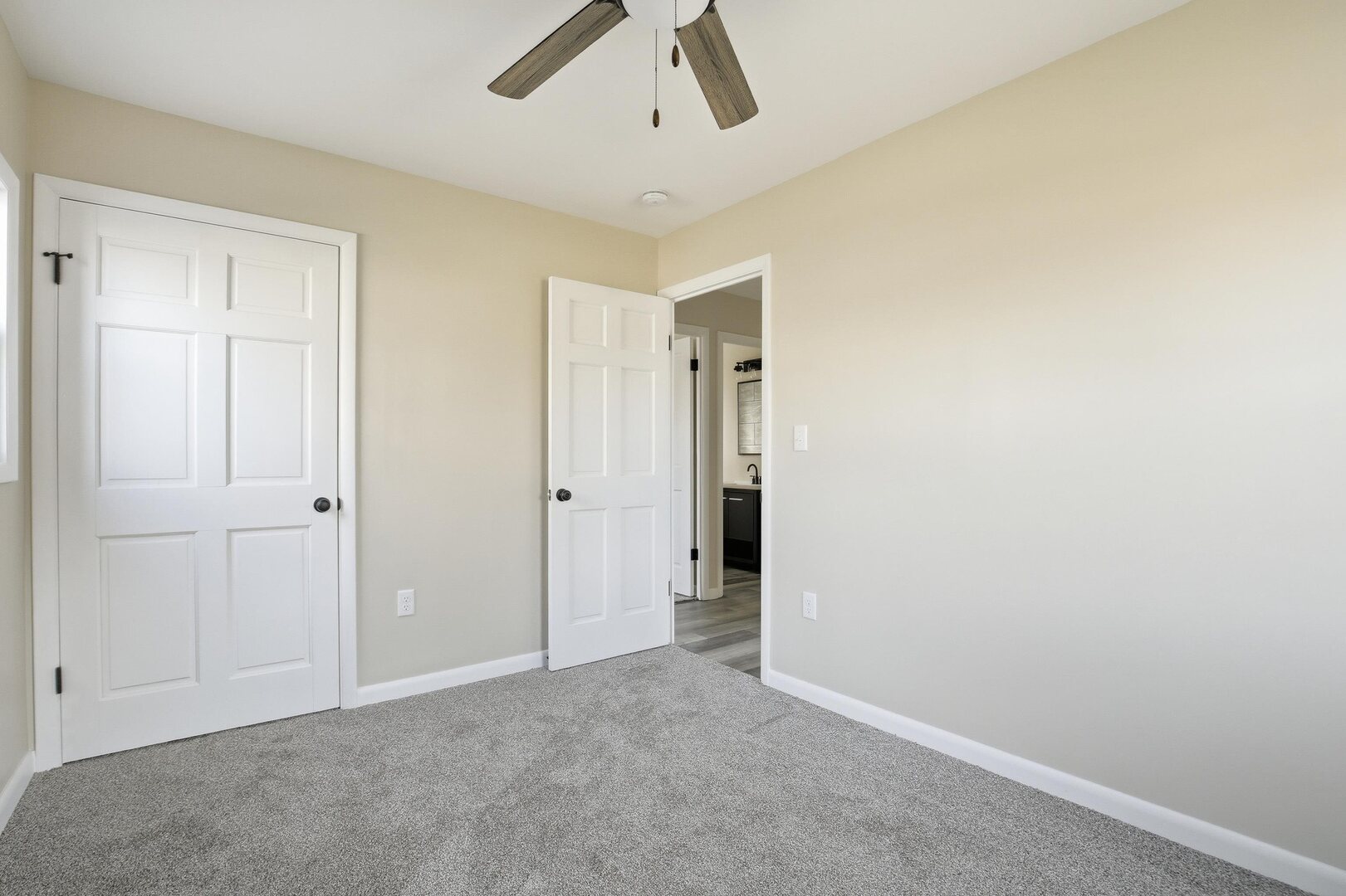 1135 6th Street West Milan, IL 61264 - Photo 15 of 36 an empty room with a ceiling fan