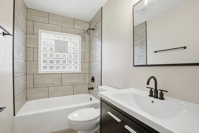 a bathroom with a sink toilet and bathtub