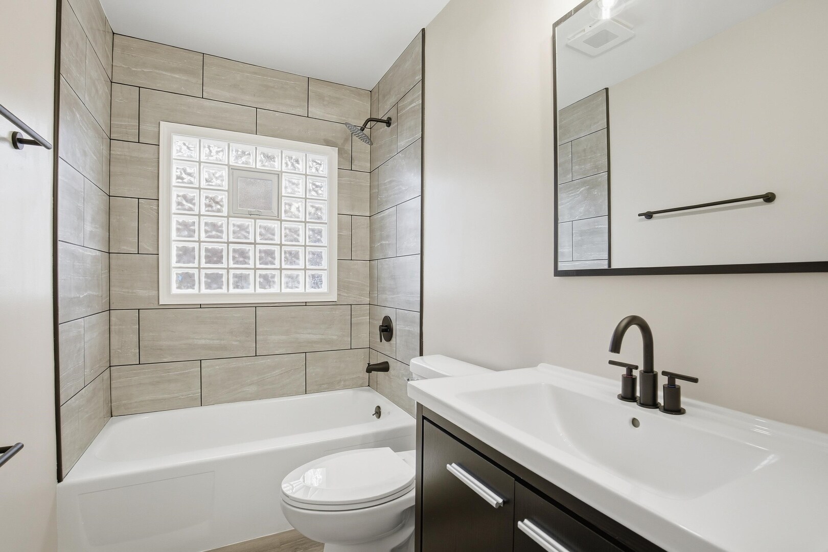 1135 6th Street West Milan, IL 61264 - Photo 18 of 36 a bathroom with a sink toilet and bathtub