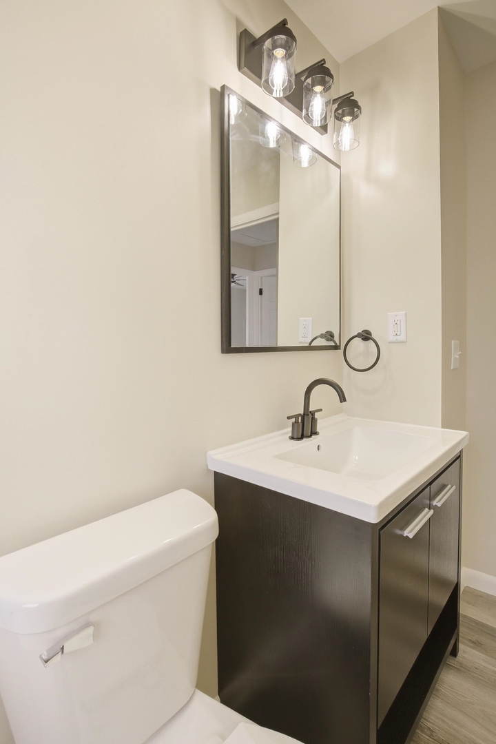 1135 6th Street West Milan, IL 61264 - Photo 20 of 36 a bathroom with a sink and a toilet