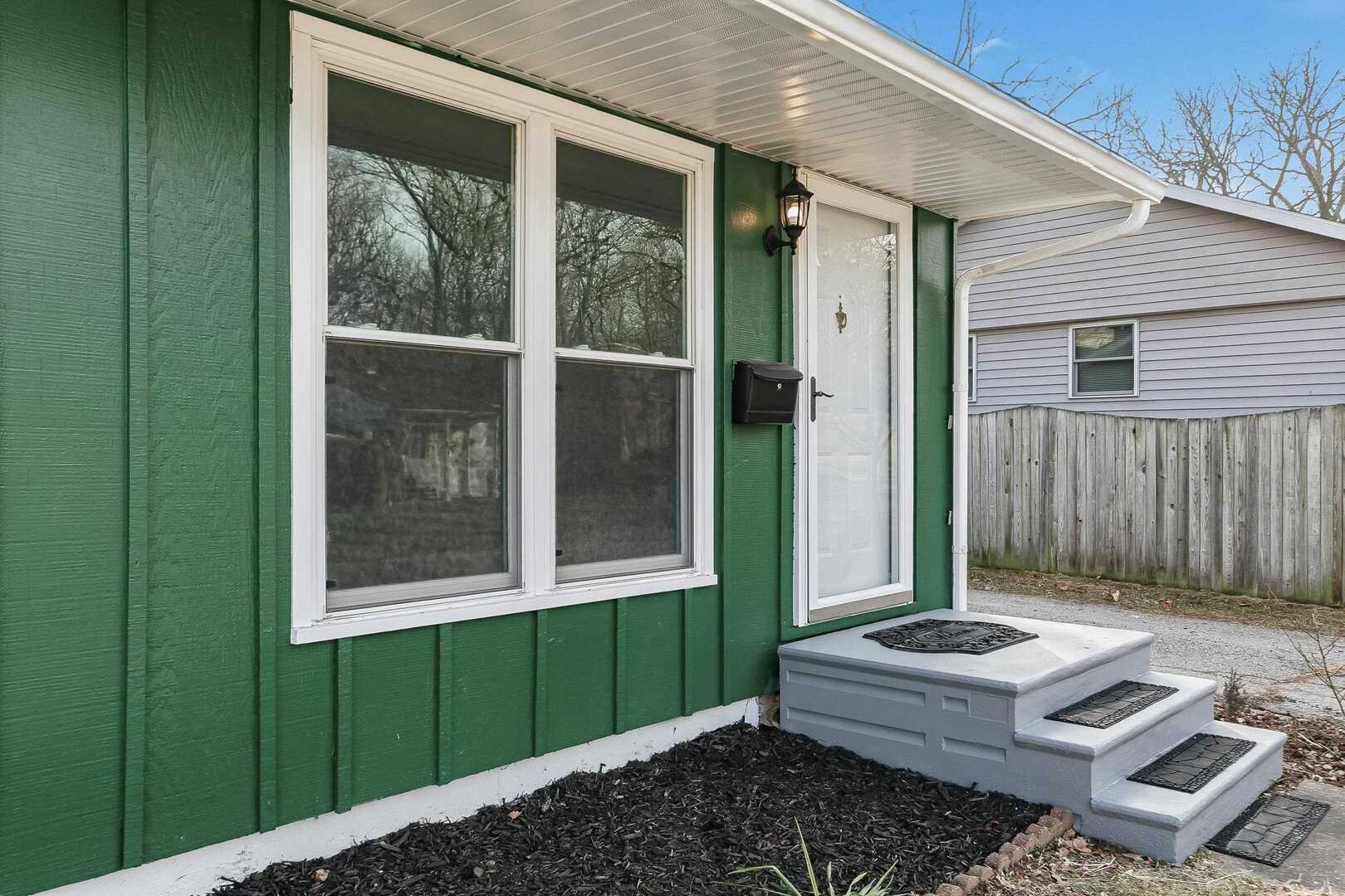 1135 6th Street West Milan, IL 61264 - Photo 2 of 36 a front view of a house with a yard