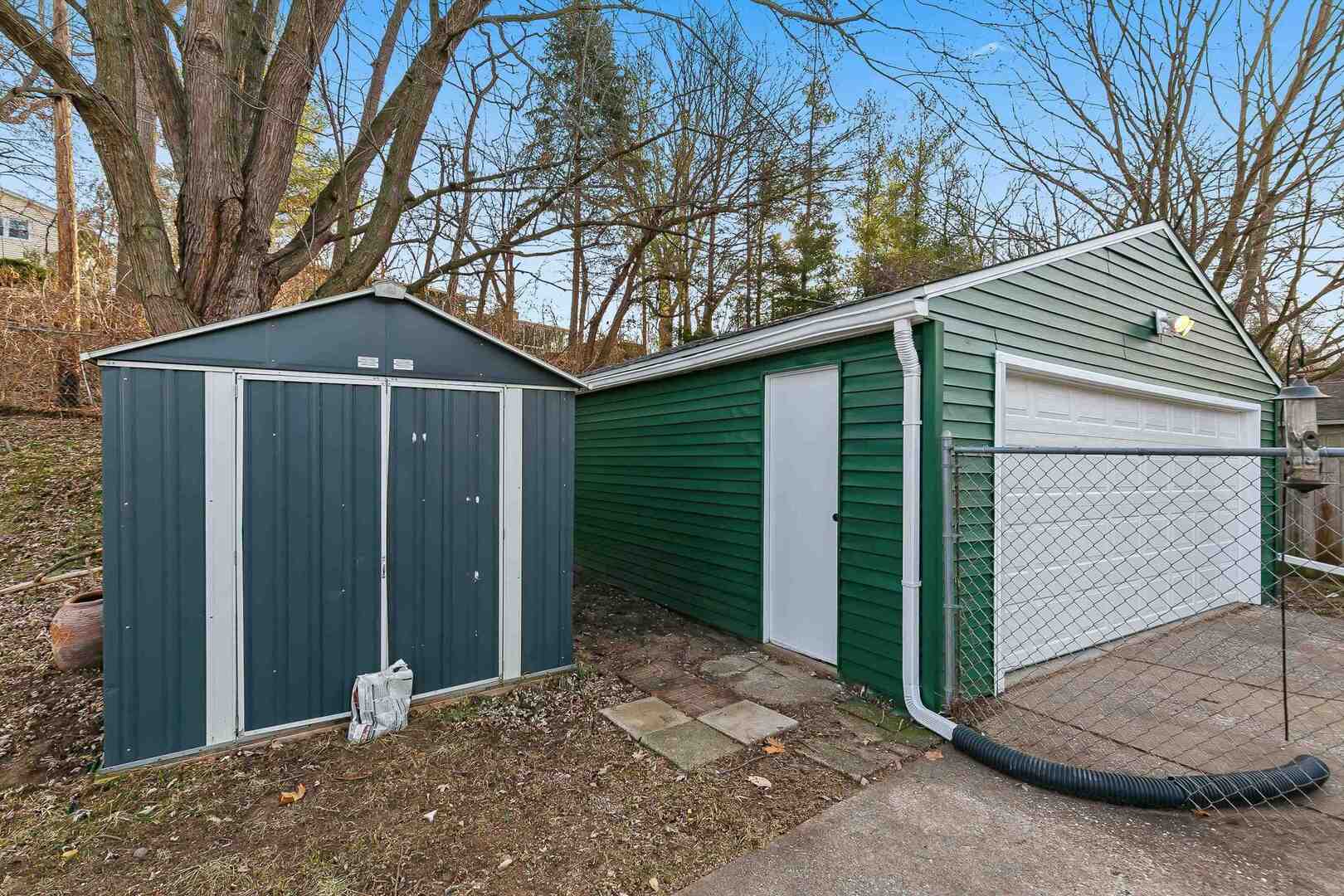 1135 6th Street West Milan, IL 61264 - Photo 35 of 36 a front view of a house with garden