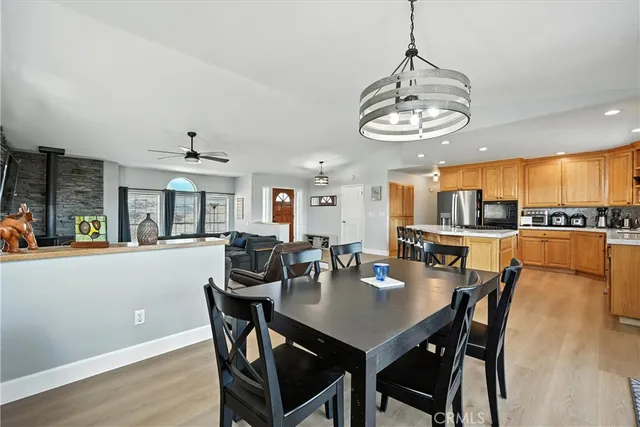 a kitchen with stainless steel appliances kitchen island granite countertop a sink and cabinets