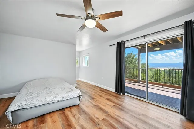a view of balcony with wooden floor