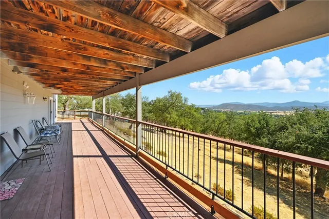 a view of balcony with wooden floor