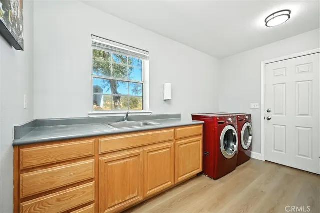 a backyard of a house with barbeque oven table and chairs