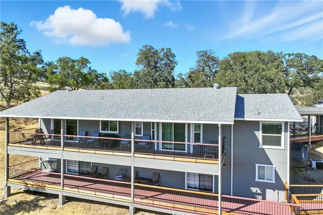 a living room with furniture a flat screen tv and a table