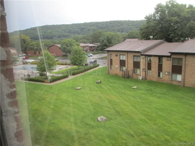 a view of a house with a big yard