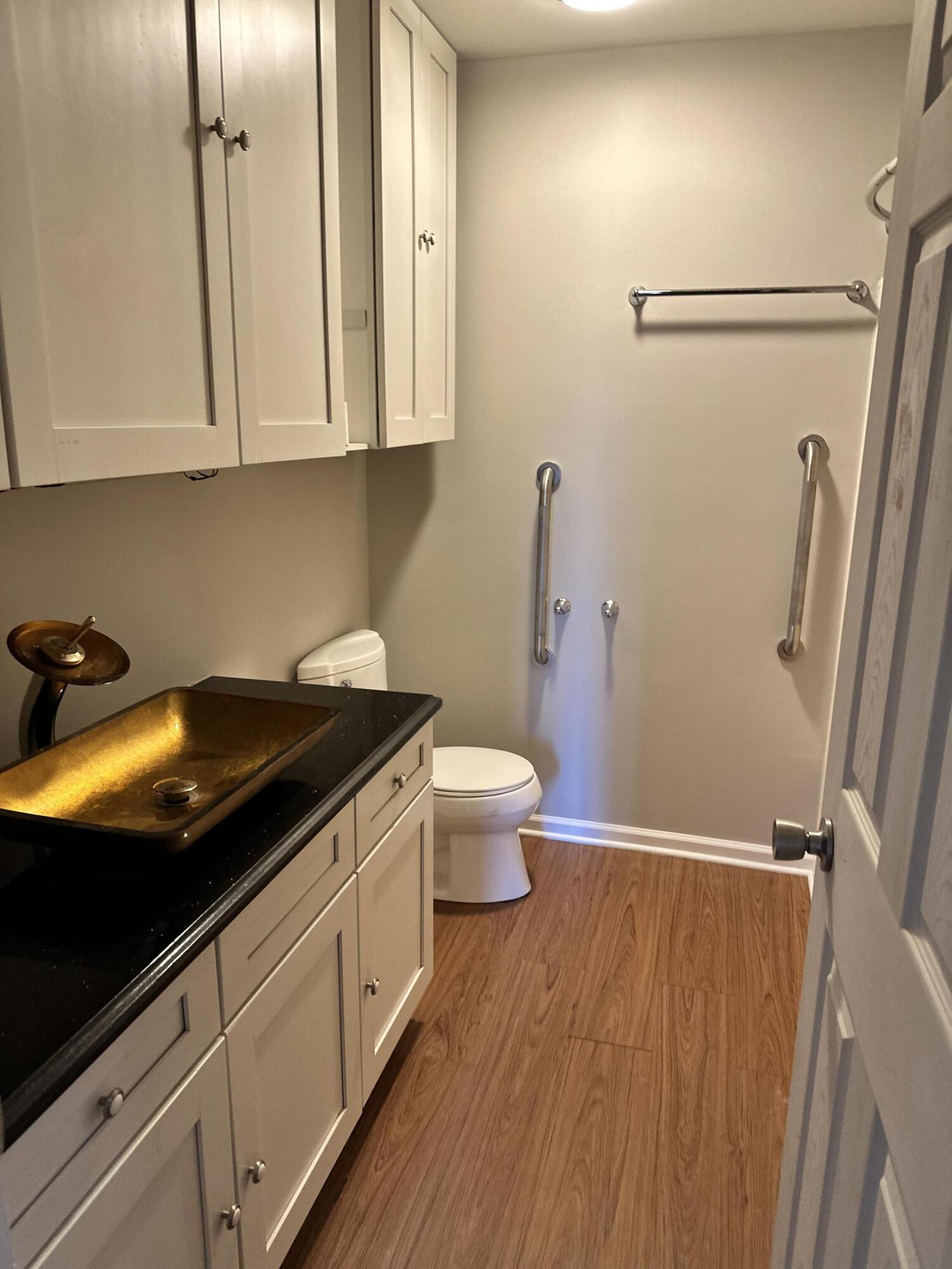 405 Old Stone Road, Unit E2 Munster, IN 46321 - Photo 17 of 20 a bathroom with a sink a toilet and shower