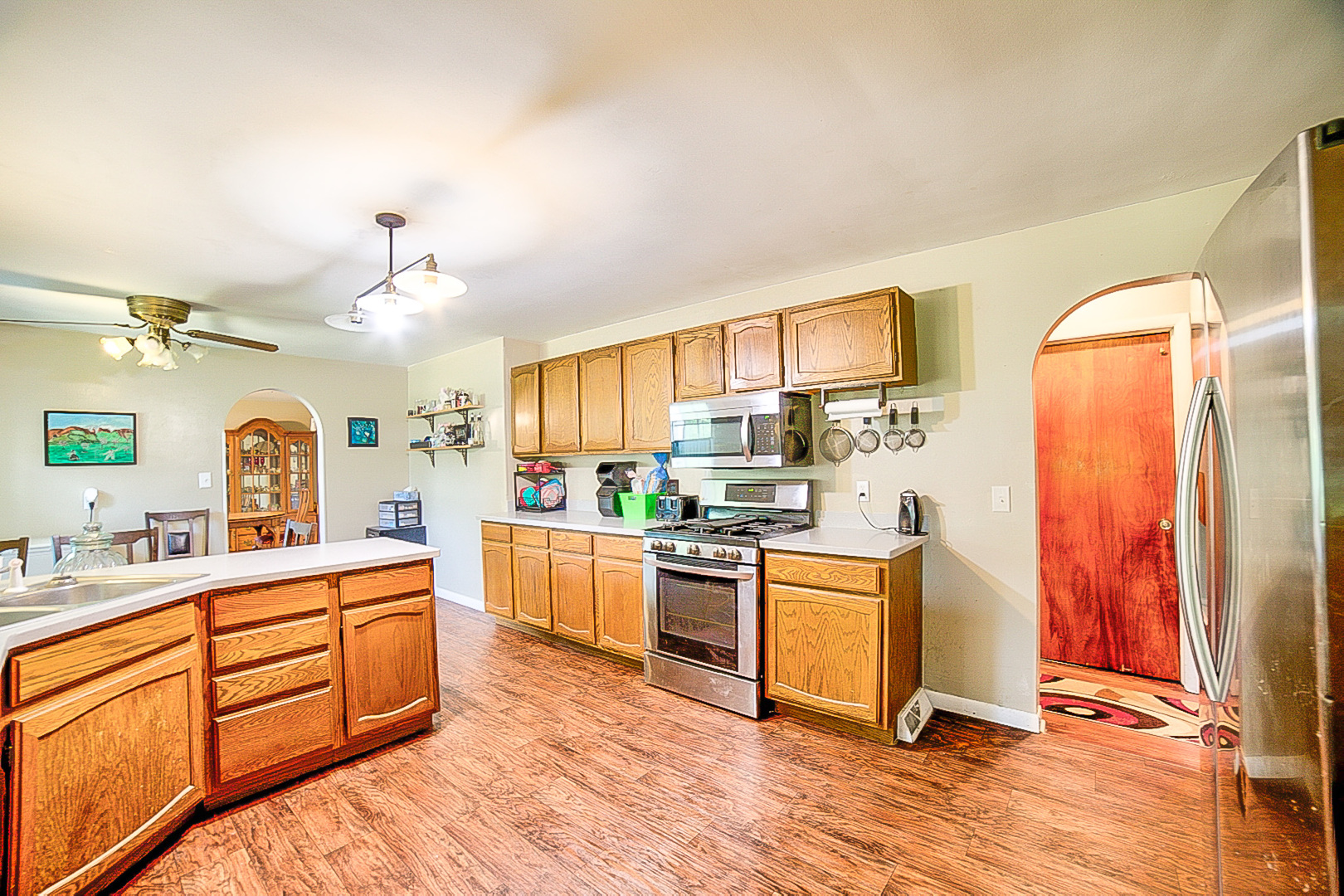 902 South 5th Street Watseka, IL 60970 - Photo 13 of 19 a kitchen with a stove a sink and a refrigerator