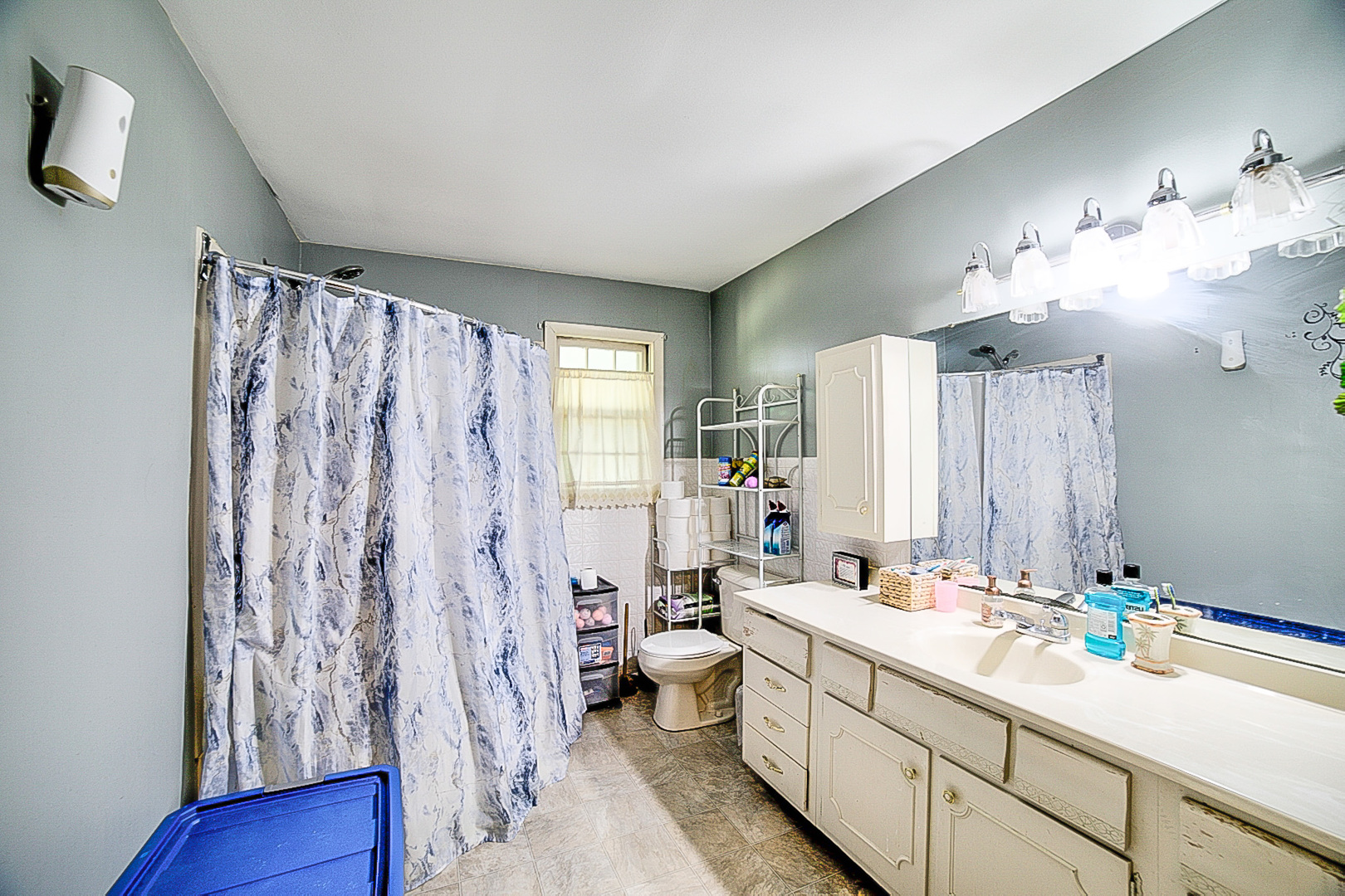 902 South 5th Street Watseka, IL 60970 - Photo 14 of 19 a bathroom with a double vanity sink toilet and shower