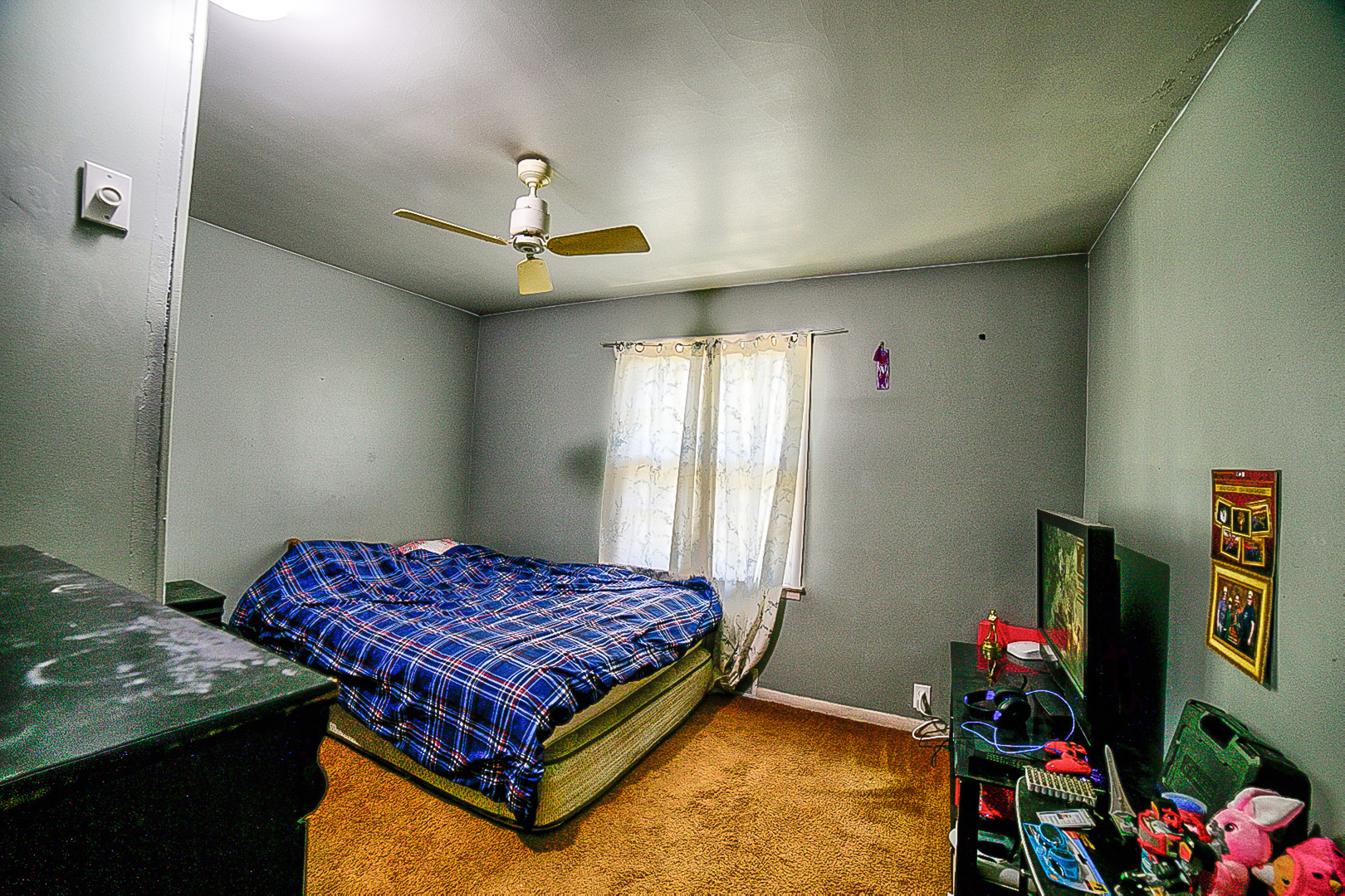 902 South 5th Street Watseka, IL 60970 - Photo 17 of 19 a bedroom with a bed and a chandelier