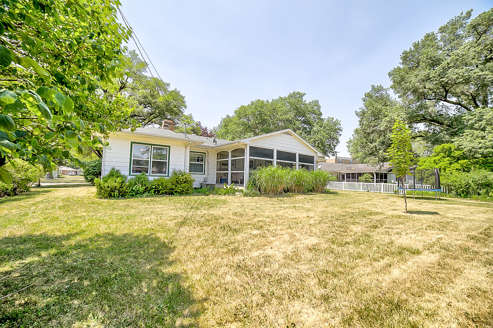 902 South 5th Street Watseka, IL 60970 - Photo 3 of 19 a front view of a house with a yard and trees