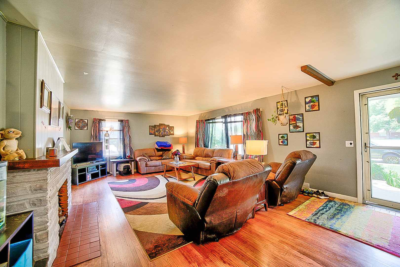 902 South 5th Street Watseka, IL 60970 - Photo 6 of 19 a living room with furniture fireplace and a window