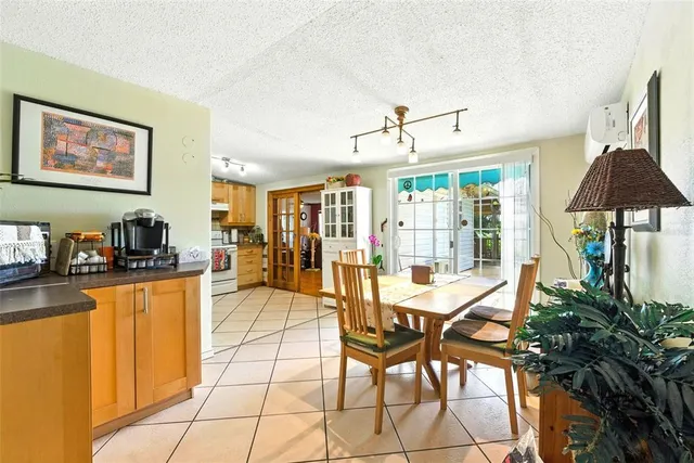 a living room with stainless steel appliances kitchen island granite countertop furniture and a kitchen view