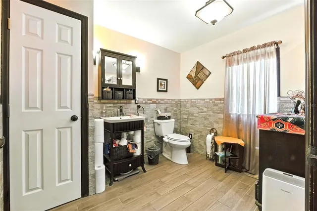 a bed room with a bed and a chair