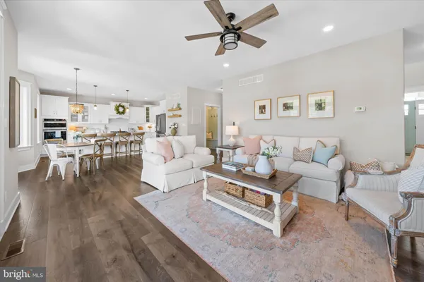 a kitchen with sink attached with living room