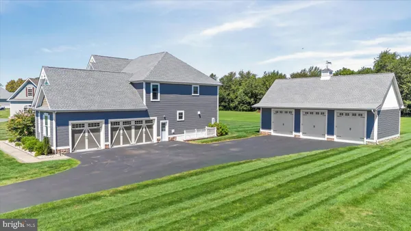 a front view of a house with a yard table and chairs