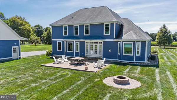 a house with potted plants in front of door