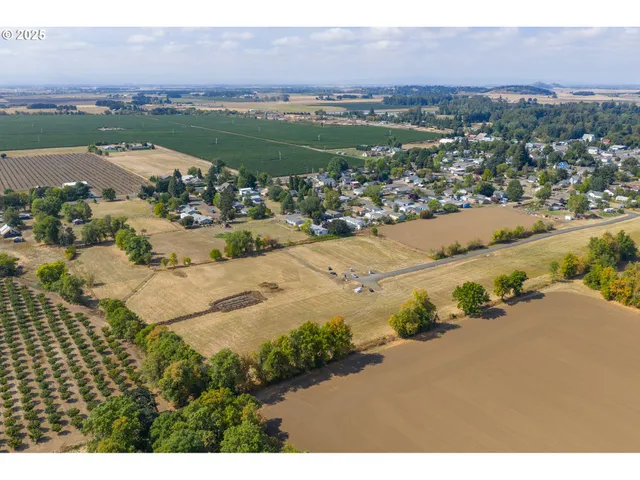 an aerial view of a city and mountain view in back