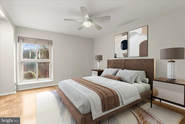 a bedroom with a large bed and a window