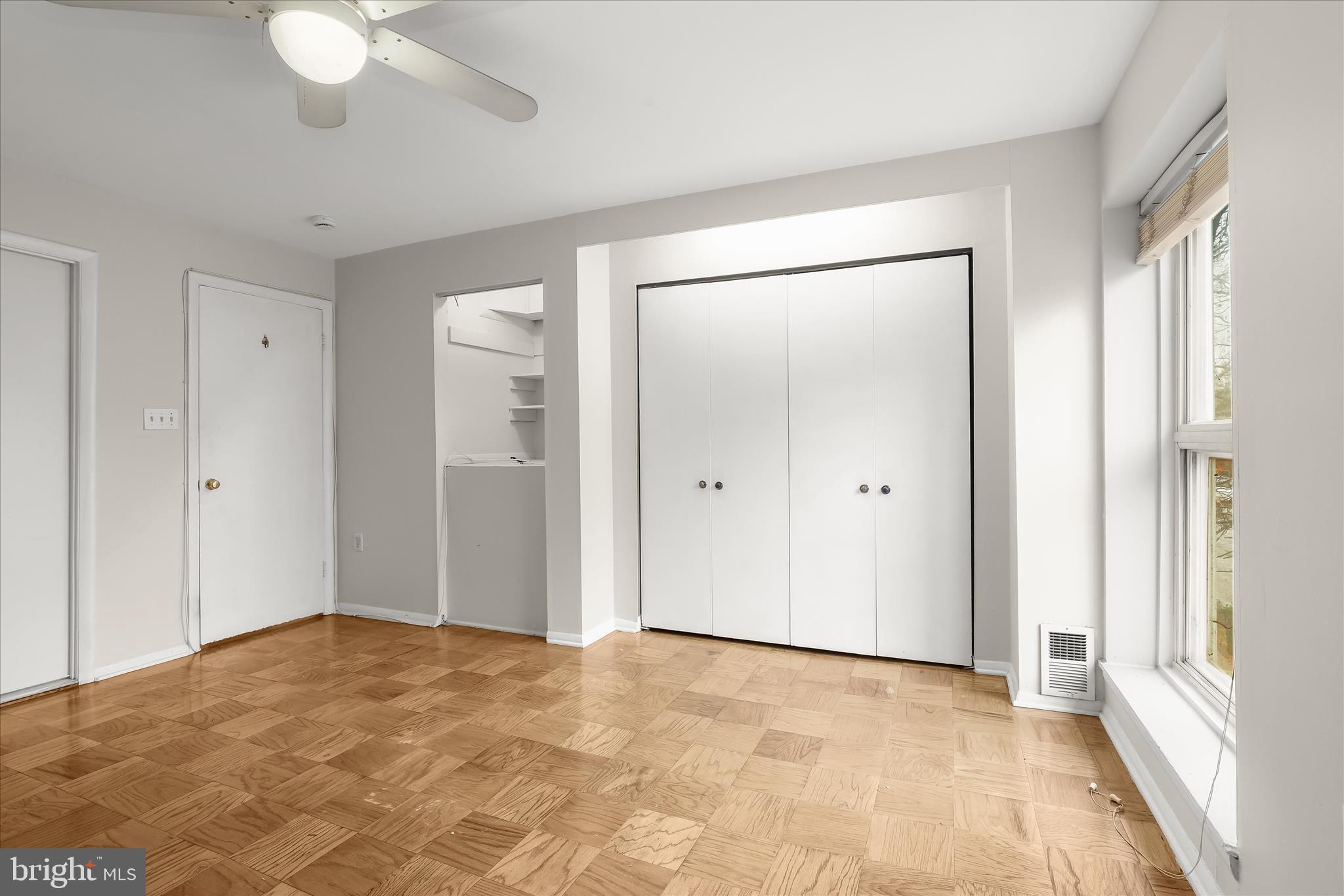 1937 Greenberry Road Baltimore, MD 21209 - Photo 12 of 29 a view of an empty room with a chandelier fan