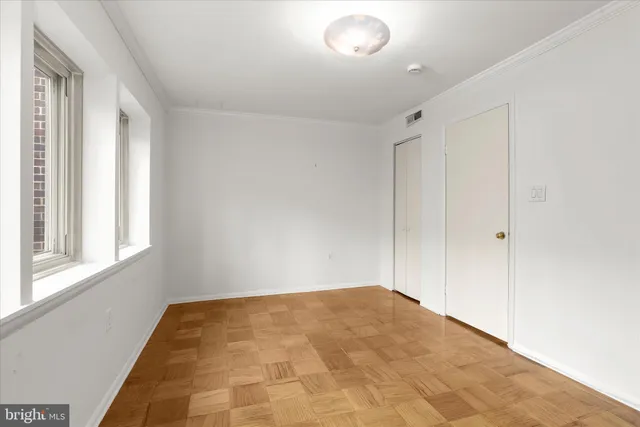 a bathroom with a shower sink vanity and toilet