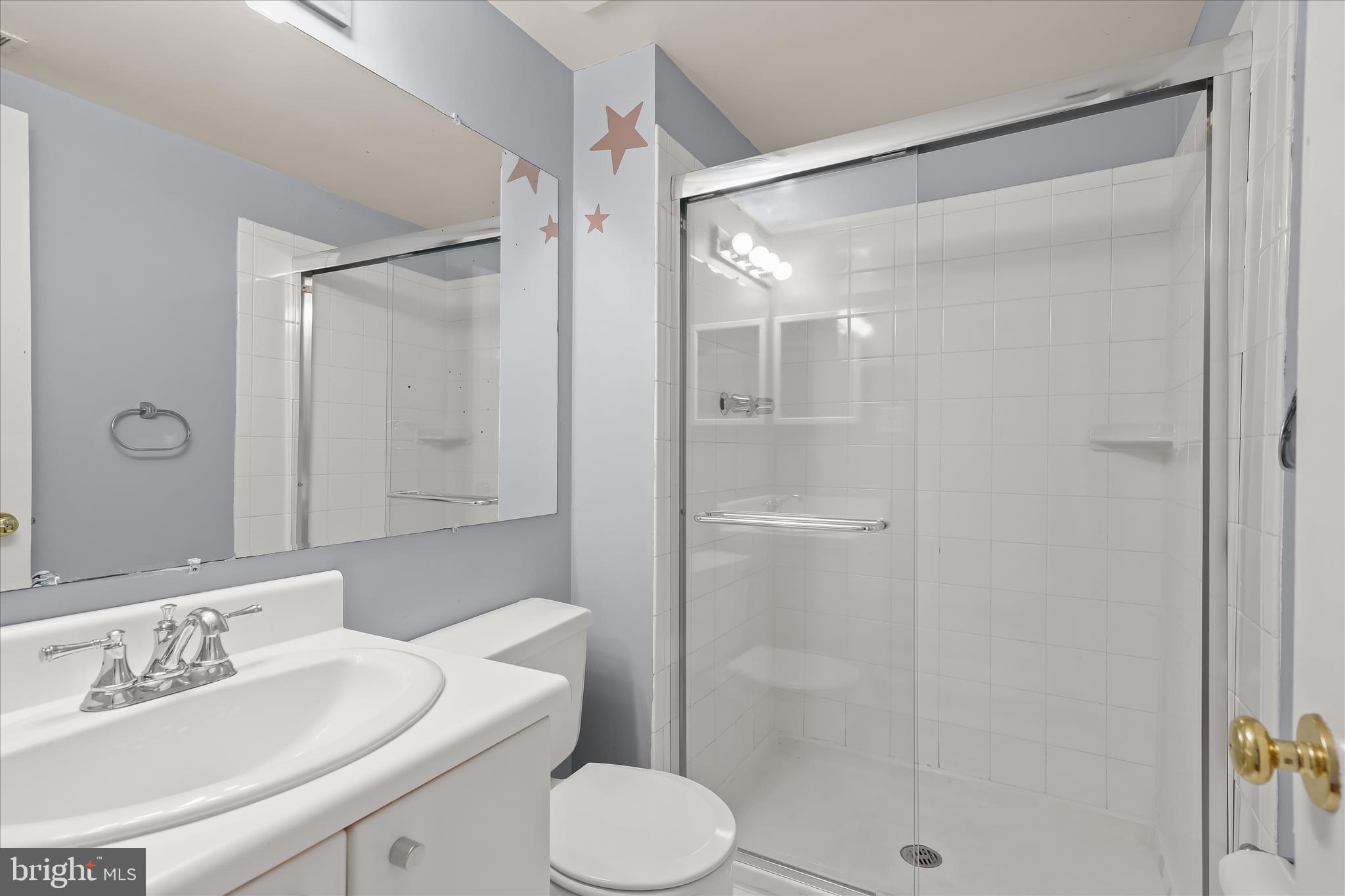 1937 Greenberry Road Baltimore, MD 21209 - Photo 19 of 29 a bathroom with a shower sink vanity and toilet