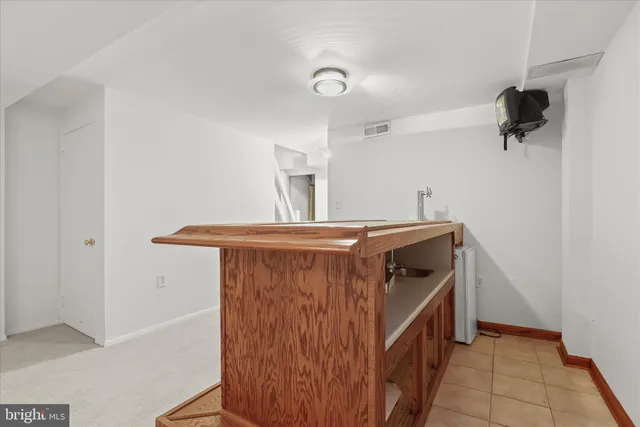 a view of a yard with wooden fence