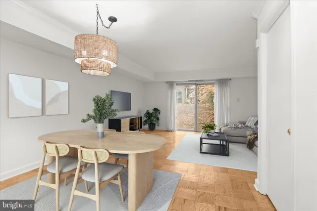 a view of a dining room with furniture wooden floor and chandelier