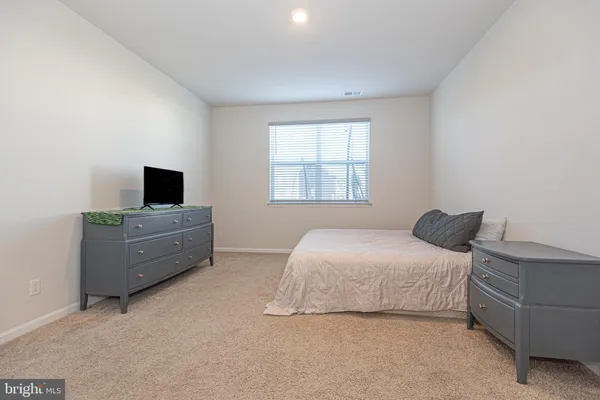 a bedroom with a bed and tv