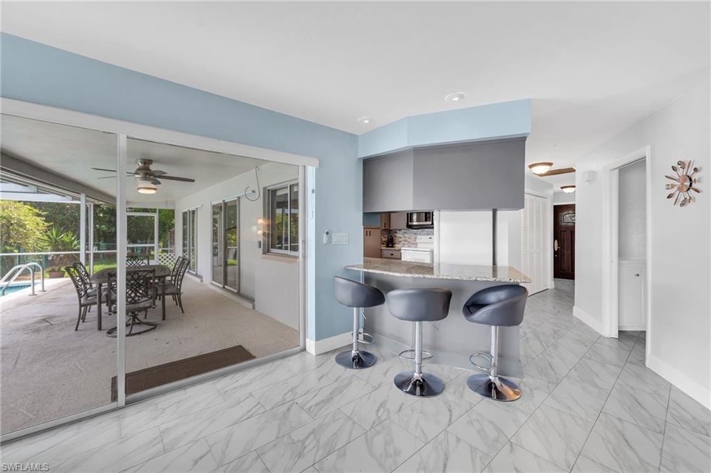 3065 50th Lane Southwest Naples, FL 34116 - Photo 12 of 31 a dining room with furniture