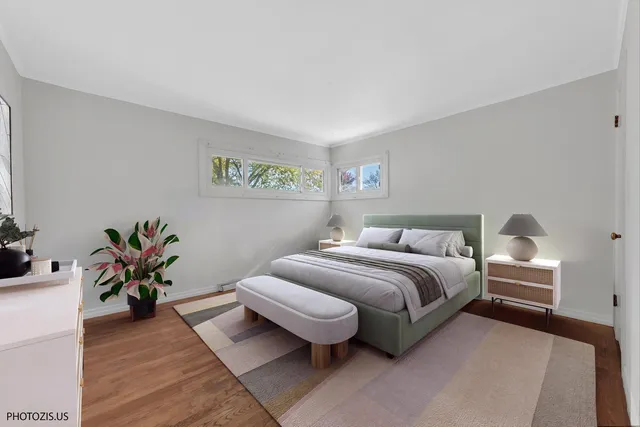 a spacious bedroom with a bed and a couch