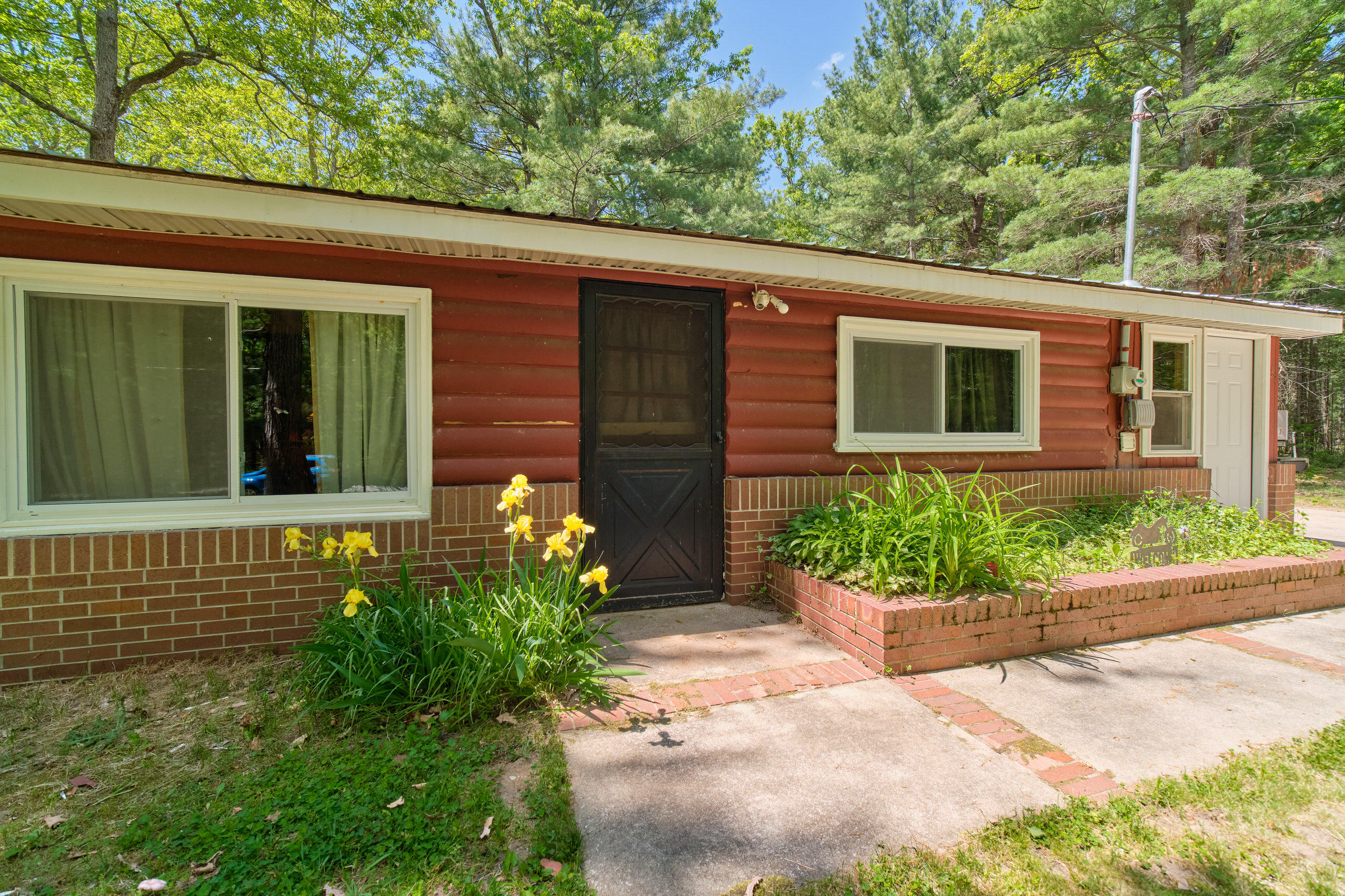 237 North Campbell Road Fountain, MI 49410 - Photo 20 of 34 Half log and brick exterior