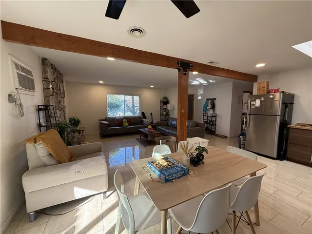 a kitchen with stainless steel appliances kitchen island granite countertop a sink and cabinets