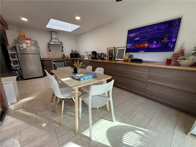 a bedroom with a bed and a table in it