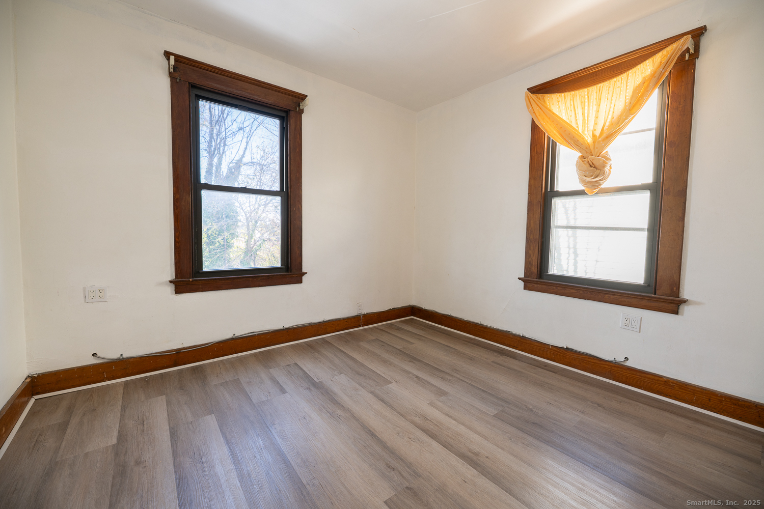 239 Forbes Avenue New Haven, CT 06512 - Photo 12 of 13 a view of an empty room with wooden floor and a window