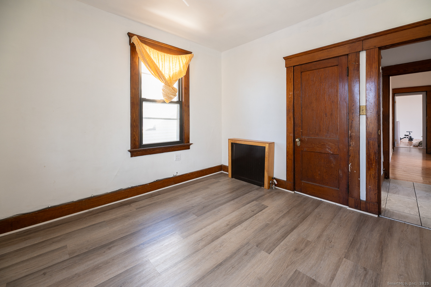 239 Forbes Avenue New Haven, CT 06512 - Photo 13 of 13 an empty room with wooden floor and windows