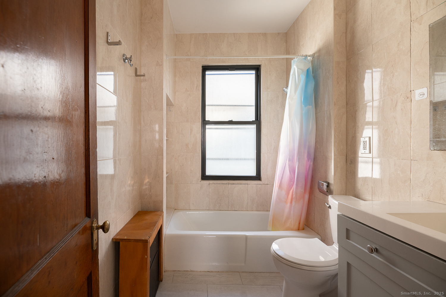 239 Forbes Avenue New Haven, CT 06512 - Photo 4 of 13 a bathroom with a bathtub toilet and sink