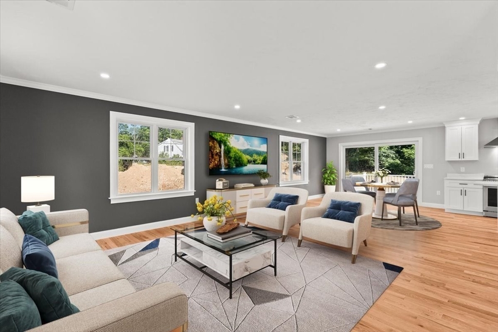 15 Elm Place Hanson, MA 02341 - Photo 15 of 27 a living room with furniture and a flat screen tv