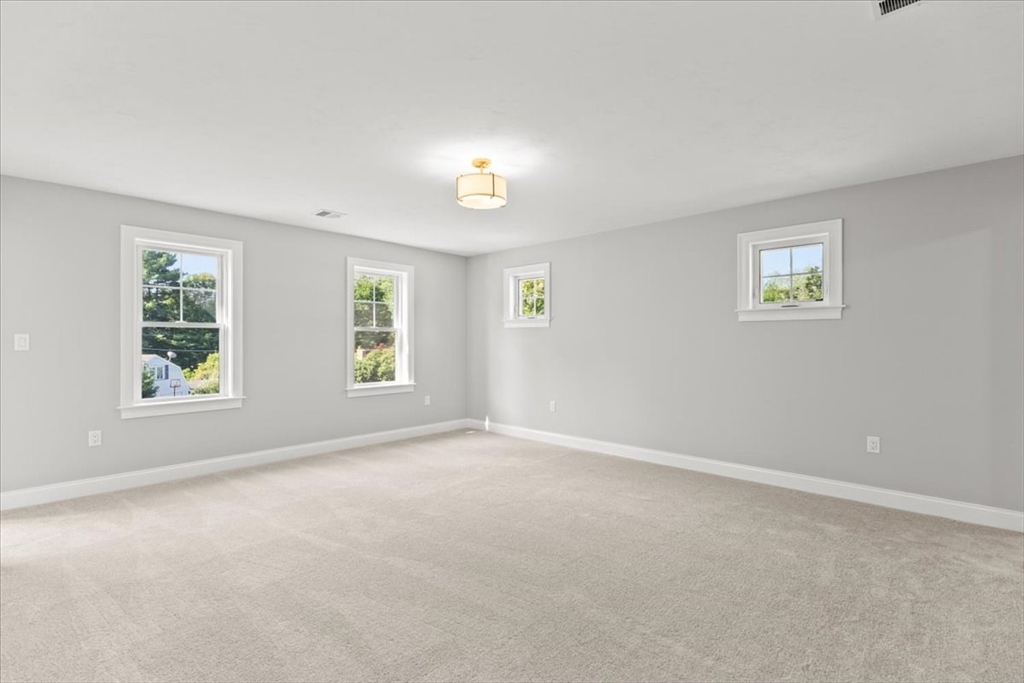 15 Elm Place Hanson, MA 02341 - Photo 25 of 27 an empty room with windows and closet