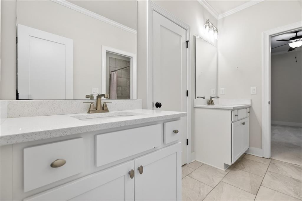 3528 North Bogan Road Buford, GA 30519 - Photo 38 of 79 a bathroom with a double vanity sink mirror and