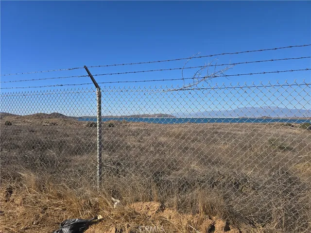 a street sign on a wall next to road