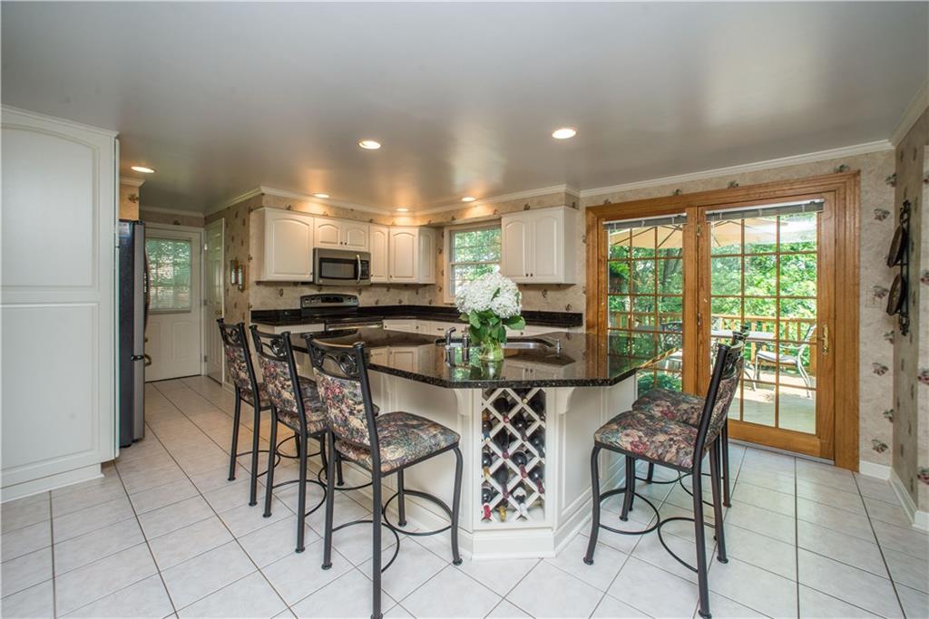 2344 Harrow Road Pittsburgh, PA 15241 - Photo 11 of 25 There is a large center island with a built in wine rack, seats up to 5 people!