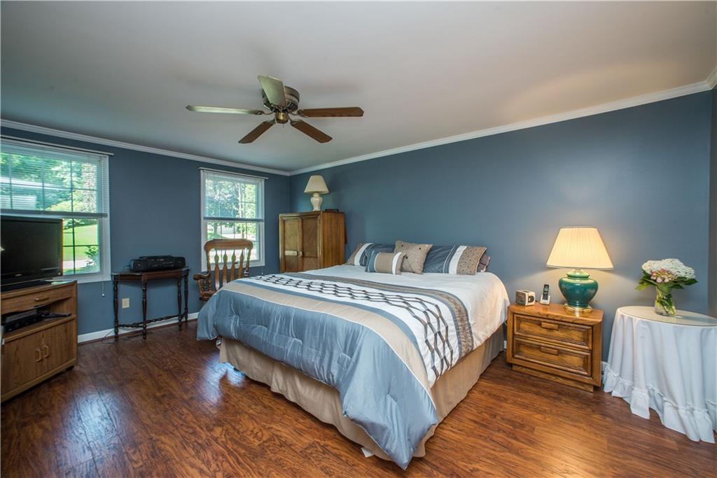 2344 Harrow Road Pittsburgh, PA 15241 - Photo 14 of 25 This spacious master bedroom has two large windows allowing great neutral light, a ceiling fan, and new floors! A great space to relax at the end of the night.