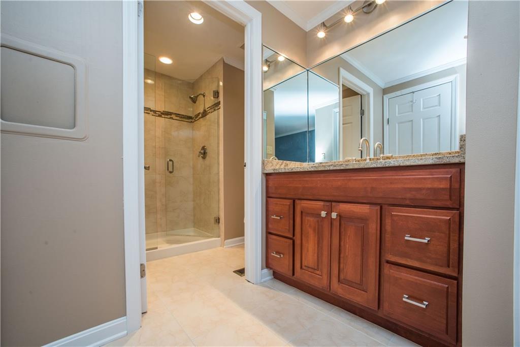 2344 Harrow Road Pittsburgh, PA 15241 - Photo 16 of 25 This newly renovated bathroom has recessed lighting, granite vanity counter tops, a beautiful neutral paint color, and a gorgeous free standing shower.