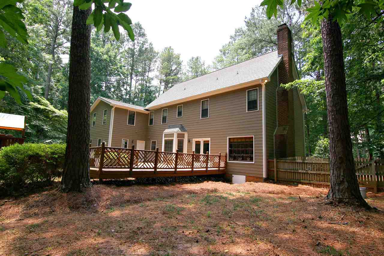 2001 Countrywood Road North Raleigh, NC 27615 - Photo 22 of 25 The lot is over an acre, and completely level. Backyard is already fenced Exterior Back