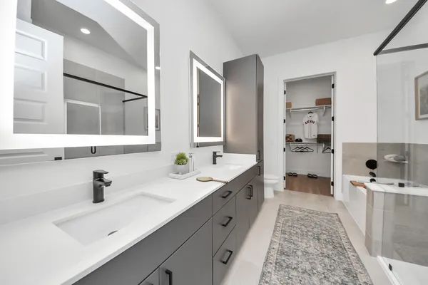 a living room with furniture fireplace and large windows