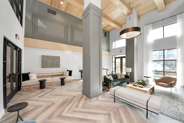 a dining room with furniture and wooden floor